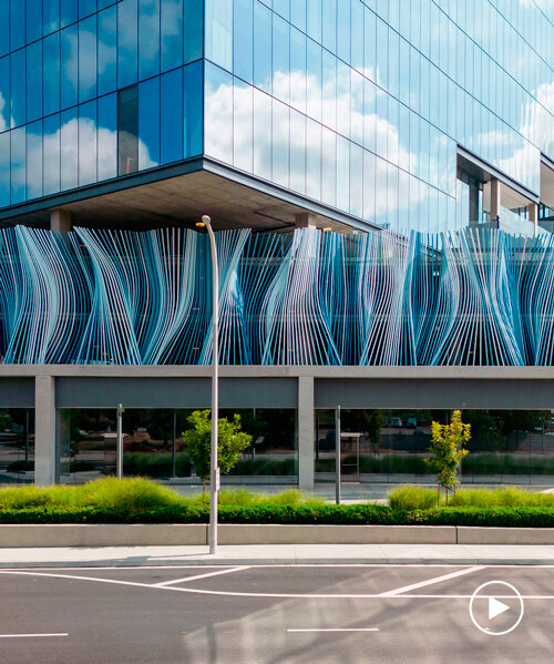 hundreds of aluminum tubes undulate shaping 'ensemble' installation by rob ley