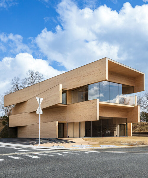 this japanese co-working space by kengo kuma combines protruding layers of CLT panels