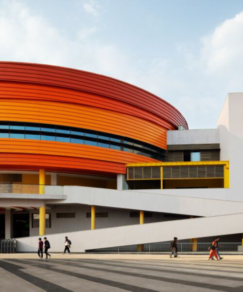 winding ramps connect concentric plaza to auditorium at university campus in bangalore