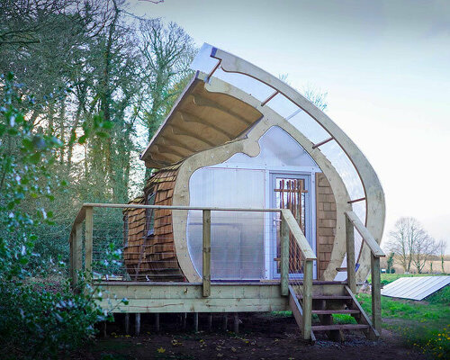 prefabricated cabin in UK woodland resembles timber monocoque structure aircraft