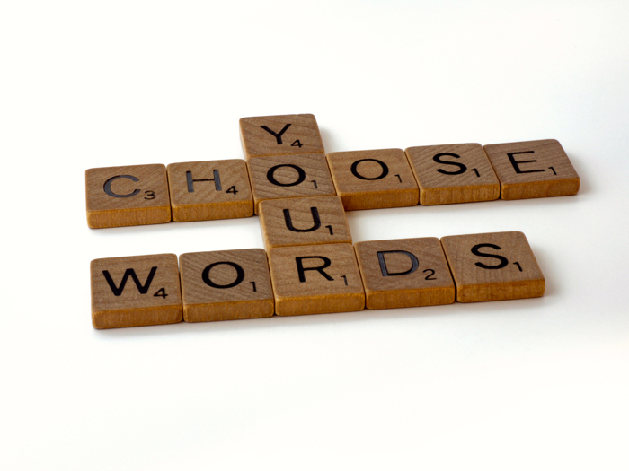 Photo of Scrabble letters spelling out 'choose your words' by Brett Jordan on Unsplash
